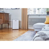 Wood's MRD20GW in White, in a living room beside a radiator and sofa