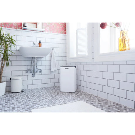 Wood's MRD20GW in White, in a tiled bathroom next to a washbasin