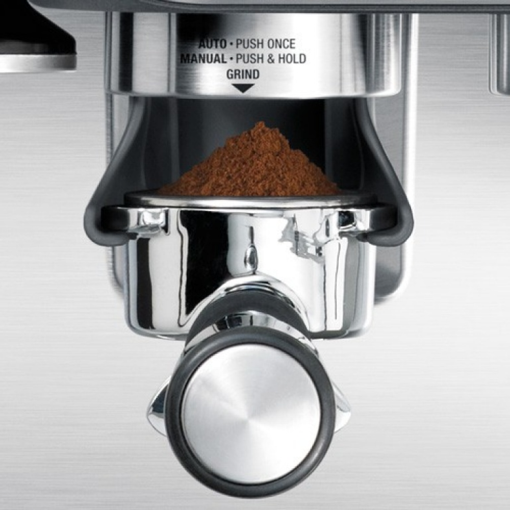 Sage Barista Express BES875UK Espresso Machine in Brushed Stainless Steel, close-up of grinding into the portafilter