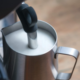Sage Barista Touch SES880BSS Espresso Machine in Brushed Stainless Steel, frothing milk with the steam wand