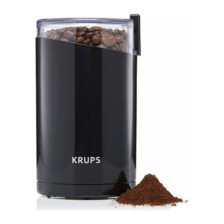 Krups F203 Coffee Grinder in Black, with ground coffee